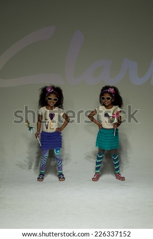 NEW YORK, NY - OCTOBER 19: Models walk the runway during the Clarks preview at petitePARADE Kids Fashion Week at Bathhouse Studios on October 19, 2014 in New York City.