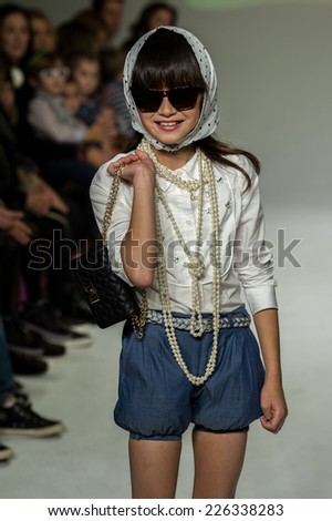 NEW YORK, NY - OCTOBER 19: A model walks the runway during the Clarks preview at petitePARADE Kids Fashion Week at Bathhouse Studios on October 19, 2014 in New York City.