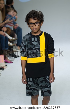 NEW YORK, NY - OCTOBER 19: A model walks the runway during the Dillonger Clothing preview at petitePARADE Kids Fashion Week at Bathhouse Studios on October 19, 2014 in New York City.