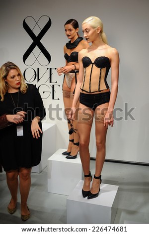 NEW YORK, NY - OCTOBER 25: Models pose sexy during Love Cage Spring 2015 lingerie presentation at the Center 548 on October 25, 2014 in New York City.