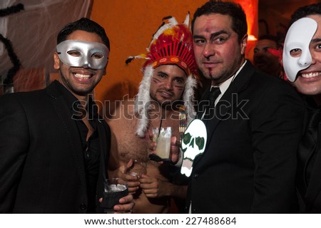 NEW YORK, NY - OCTOBER 31: Guests in mascarade costumes posing at The Fashion Party during Halloween event at the West Village Crema Restaurant on October 31, 2014 in New York City.