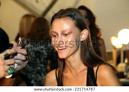 NEW YORK, NY - SEPTEMBER 06: A model has her make-up done backstage at Venexiana during Mercedes-Benz Fashion Week Spring 2015 at Lincoln Center on September 6, 2014 in NYC