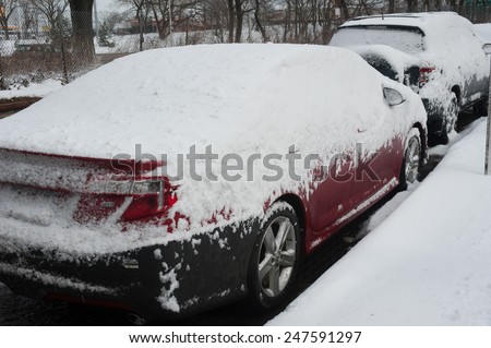 NEW YORK JANUARY 27: A car remains buried in the snow on Emmons Ave in the Broooklyn, New York on Tuesday, January 27, 2015, the day after the snow blizzard of 2015.
