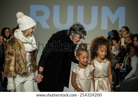 NEW YORK, NY - OCTOBER 19: Designer Nina Miner walks the runway with models during the Ruum preview at petitePARADE / Kids Fashion Week at Bathhouse Studios on October 19, 2014 in New York City.