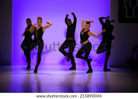NEW YORK, NY - FEBRUARY 19:Group of dancers performs at opening of the New York Life fashion show during MBFW Fall 2015 at Lincoln Center on February 19, 2015 in NYC.