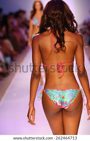 MIAMI, FL - JULY 20: A model walks the runway at the Luli Fama during MBFW Swim 2015 at The Raleigh hotel on July 20, 2014 in Miami, FL.