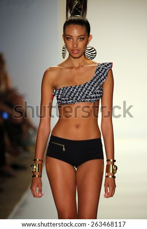 MIAMI, FL - JULY 18: A model walks the runway at the Dolores Cortes fashion show during MBFW Swim 2015 at The Raleigh hotel on July 18, 2014 in Miami, FL.