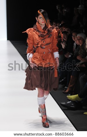 MOSCOW - OCTOBER 23: Model walks runway at the Yegor Zaitsev Collection playing role of  Hitler for Spring/ Summer 2012 during Volvo Fashion Week on October 23, 2011 in Moscow, Russia