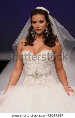 NEW YORK - OCTOBER 16: Model walking runway at the Eve of Milady Bridal Collection for Spring/ Summer 2012 during NY Bridal Fashion Week on October 16, 2011 in New York, USA