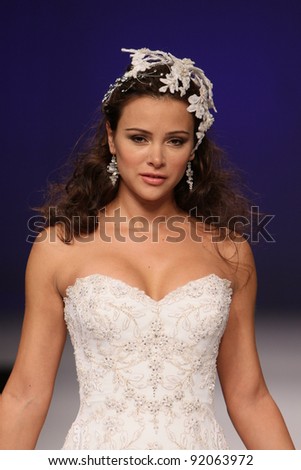NEW YORK - OCTOBER 16: Model walking runway at the Eve of Milady Bridal Collection for Spring/ Summer 2012 during NY Bridal Fashion Week on October 16, 2011 in New York, USA