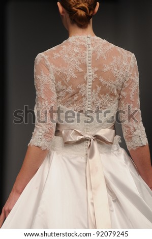 NEW YORK - OCTOBER 16: Model walking runway at the Anne Barge Bridal Collection for Spring/ Summer 2012 during NY Bridal Fashion Week on October 16, 2011 in New York, USA