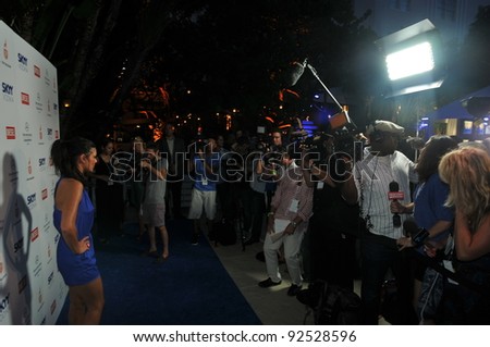 MIAMI - JULY 14: Models, Photographers and guests at the Official opening pool party at Railegh Hotel South Beach for Mercedes-Benz Swim Fashion Week on July 14, 2011 in Miami, FL