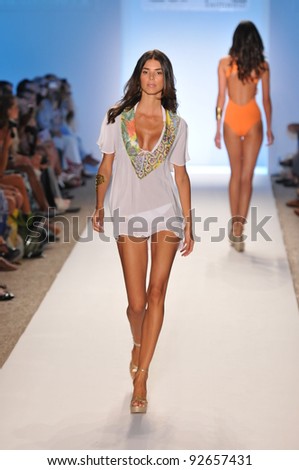 MIAMI - JULY 16: Model walking runway at the Caffe Swimwear Collection for Spring/ Summer 2012 during Mercedes-Benz Swim Fashion Week on July 16, 2011 in Miami, FL