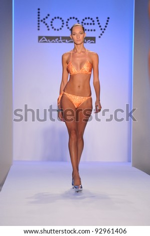 MIAMI - JULY 18: Model walking runway at the Kooey Swimwear Collection for Spring/ Summer 2012 during Mercedes-Benz Swim Fashion Week on July 18, 2011 in Miami, FL