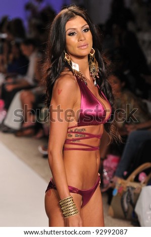 MIAMI - JULY 18: Model walking runway at the Have Faith Collection for Spring/ Summer 2012 during Mercedes-Benz Swim Fashion Week on July 18, 2011 in Miami, FL