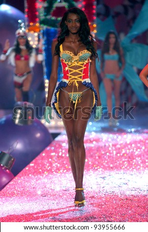 NEW YORK - NOVEMBER 9: Victoria's Secret Fashion model Oluchi Onweagba walks the runway during the 2010 Victoria's Secret Fashion Show on November 9, 2005 at the Lexington Armory in New York City.