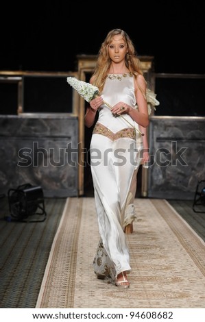 NEW YORK, NY - SEPTEMBER 15: A model walks the runway at the GULI Spring/Summer 2012 Collection at Cipriani 42nd Street on September 15, 2011 in New York City.