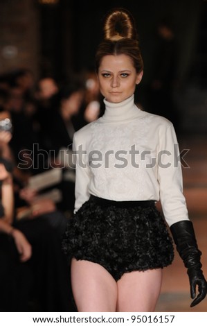 NEW YORK, NY - FEBRUARY 10: Model walks the runway at the Victor de Souza Fall / Winter 2012 fashion show during Mercedes-Benz Fashion Week at Bowery hotel on February 10, 2012 in NYC