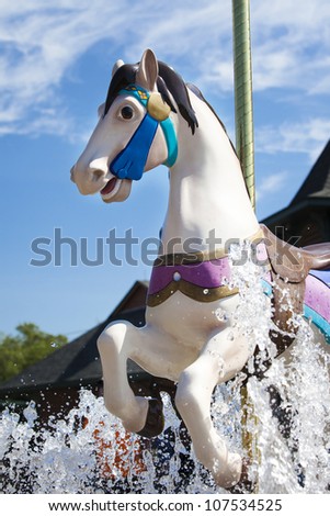 PITTSBURGH, PENNSYLVANIA/USA-JULY 9: The carousel horse welcomes guests at the entrance gates at Kennywood. Located in Pittsburgh, Pennsylvania on July 9,2012. Kennywood is open for it\'s 115th season.
