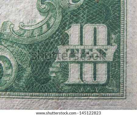 Ten 10 dollars US Currency close up macro of number ten on ten dollar bill