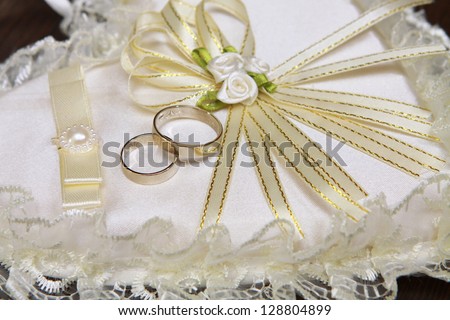 Wedding accessory. Heart-shaped pillow with wedding rings