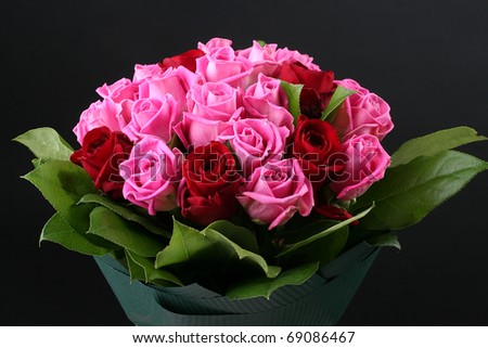 Bouquet of red roses on a black background