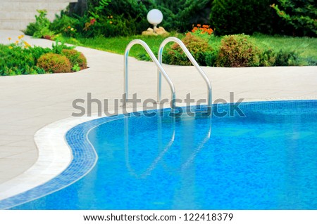 Swimming Pool With Stair At Hotel Close Up