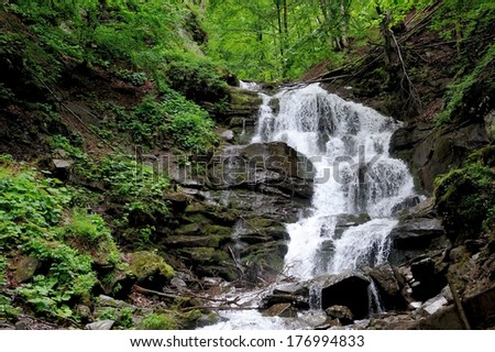 Waterfall in forest. In the deep forest on mountain