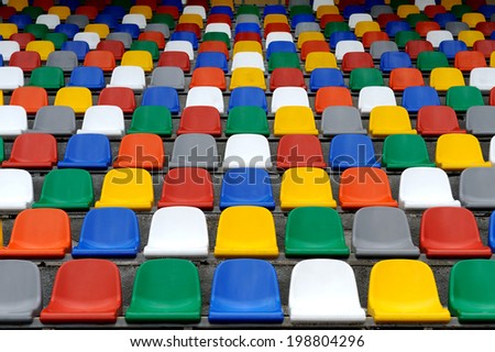 Plastic colorful chairs stands on stadium