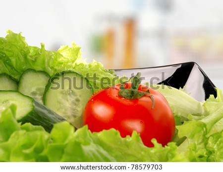 Tomato, salad, cucumber, salad leaf on dish