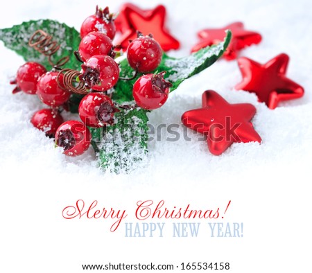 Christmas decorations of bauble are with stars on snow with sample text