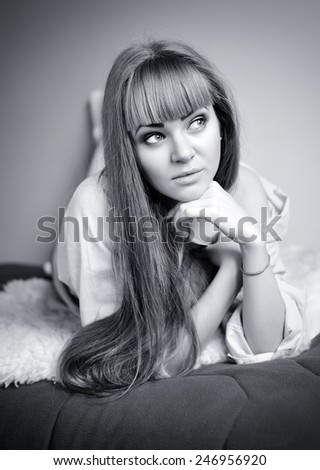 Home portrait of beautiful young woman, selective soft focus