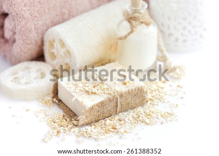 Handmade soap with oatmeal and milk on a white background