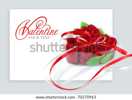 Heart-shaped box with red roses on a white background