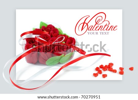 Heart-shaped box with red roses on a white background