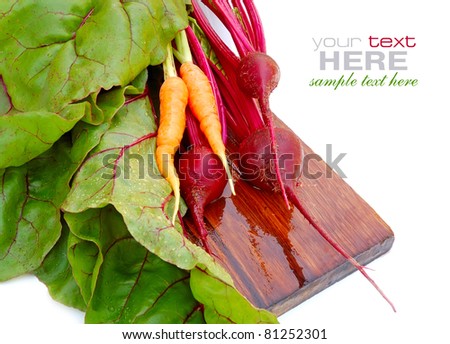 Fresh beet roots and carrot on a white background