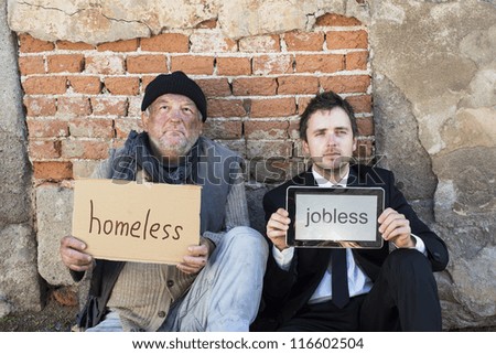 Homeless men are begging on the street.