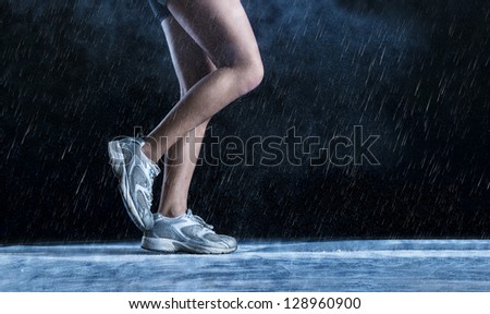 Detail of runne feet running in misty dark