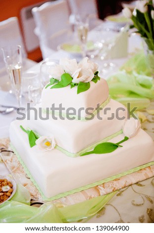 Beautiful and tasty wedding cake at wedding reception