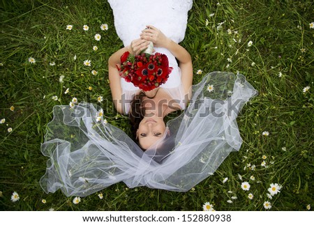 Happy bride enjoying her wedding day in nature