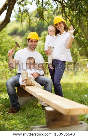 Young family is doing a building work together