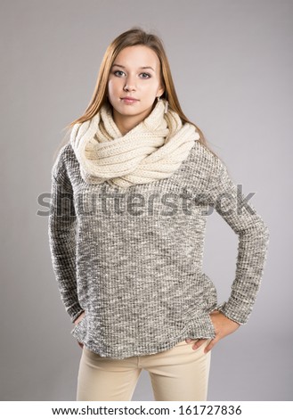 Beautiful Woman In Sweater Is Posing In Studio, Winter Fashion