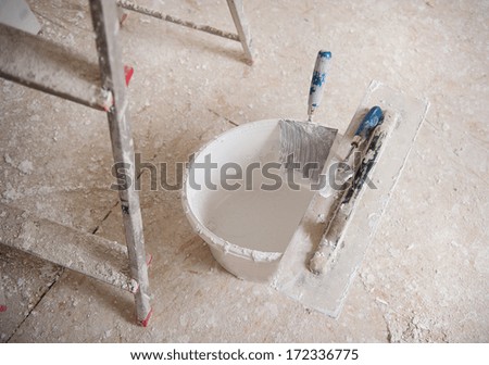Detail of building site painting equipment in the house