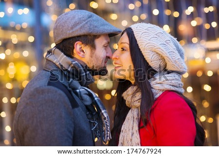 Romantic portrait of young couple in winter town