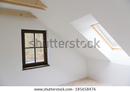 Empty unfinished room with white walls in a new constructed house