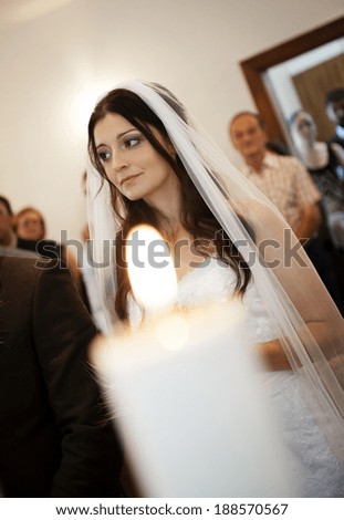 Bride and groom in church at the wedding day