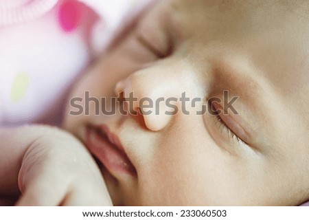 Cute sleeping baby on the bed indoors
