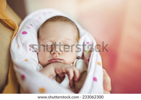 Cute sleeping baby on the bed indoors