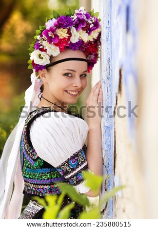 Beautiful woman wearing traditional Eastern Europe folk costumes.