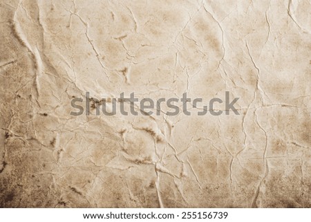 Piece of old rumpled stained paper as background